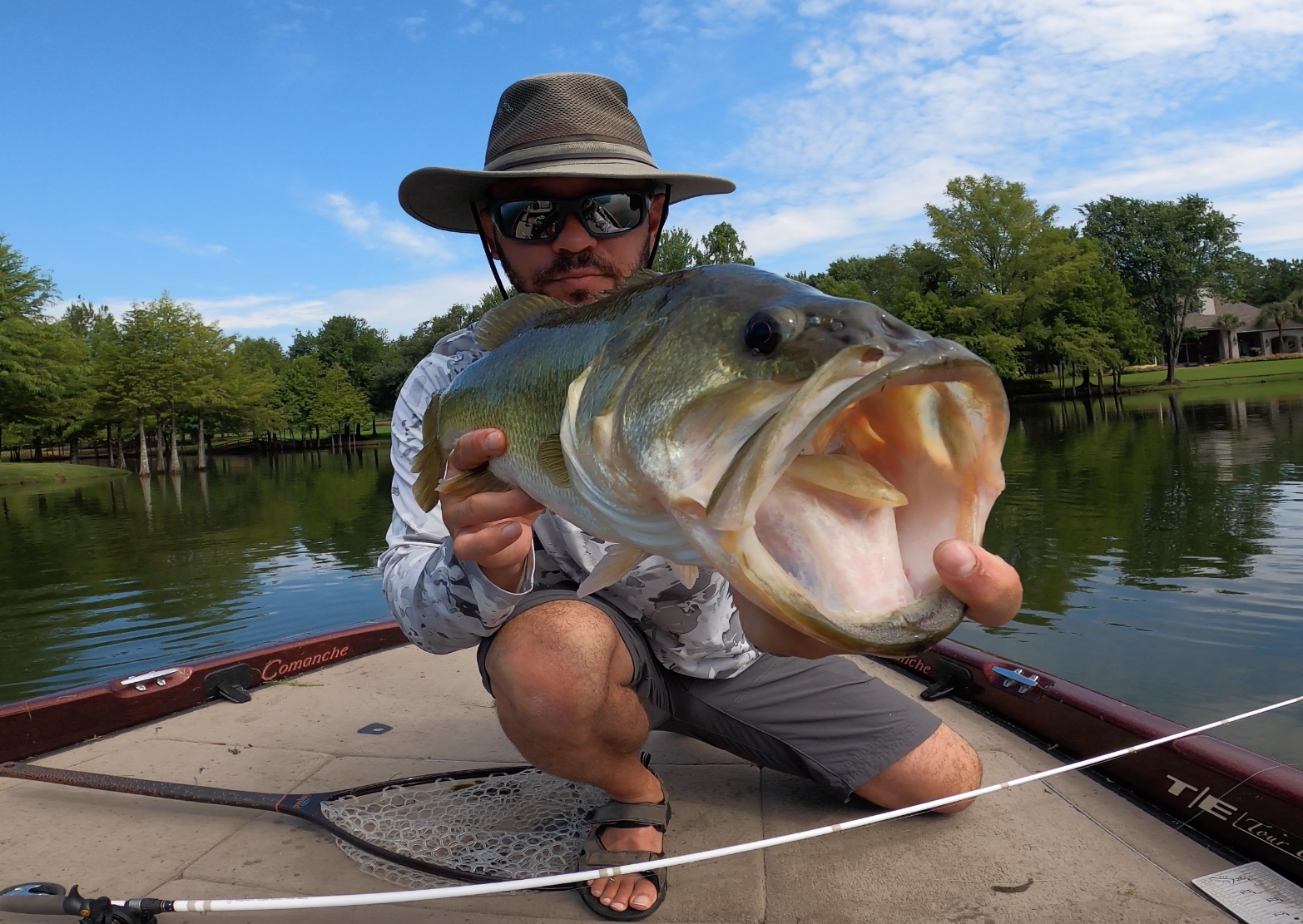 Original photograph of Colby holding a fish on a boat